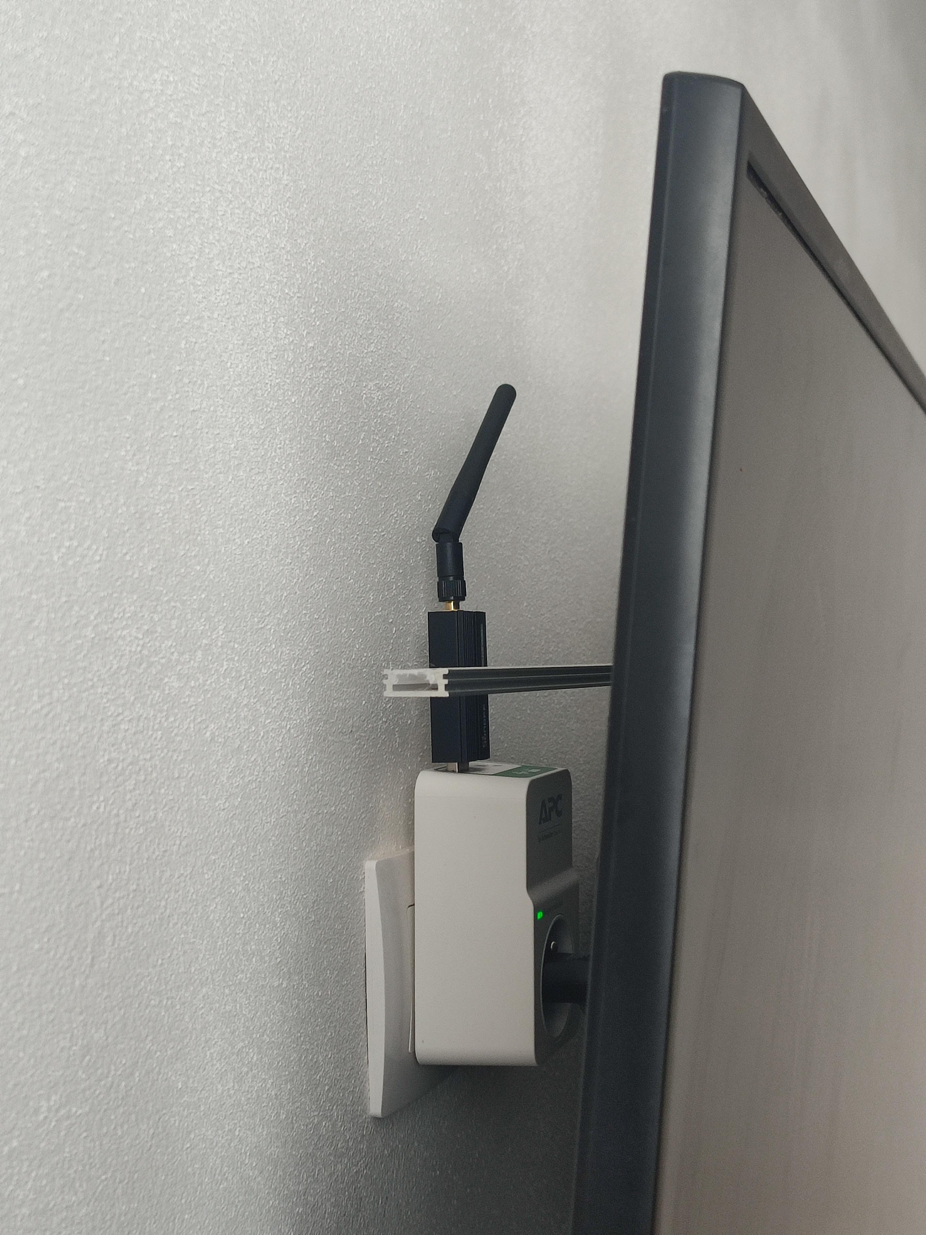 Sonoff ZBDongle-E on APC SurgeArrest PM1WU2-FR hidden behind TV Sonoff ZBDongle-E on APC SurgeArrest PM1WU2-FR hidden behind TV